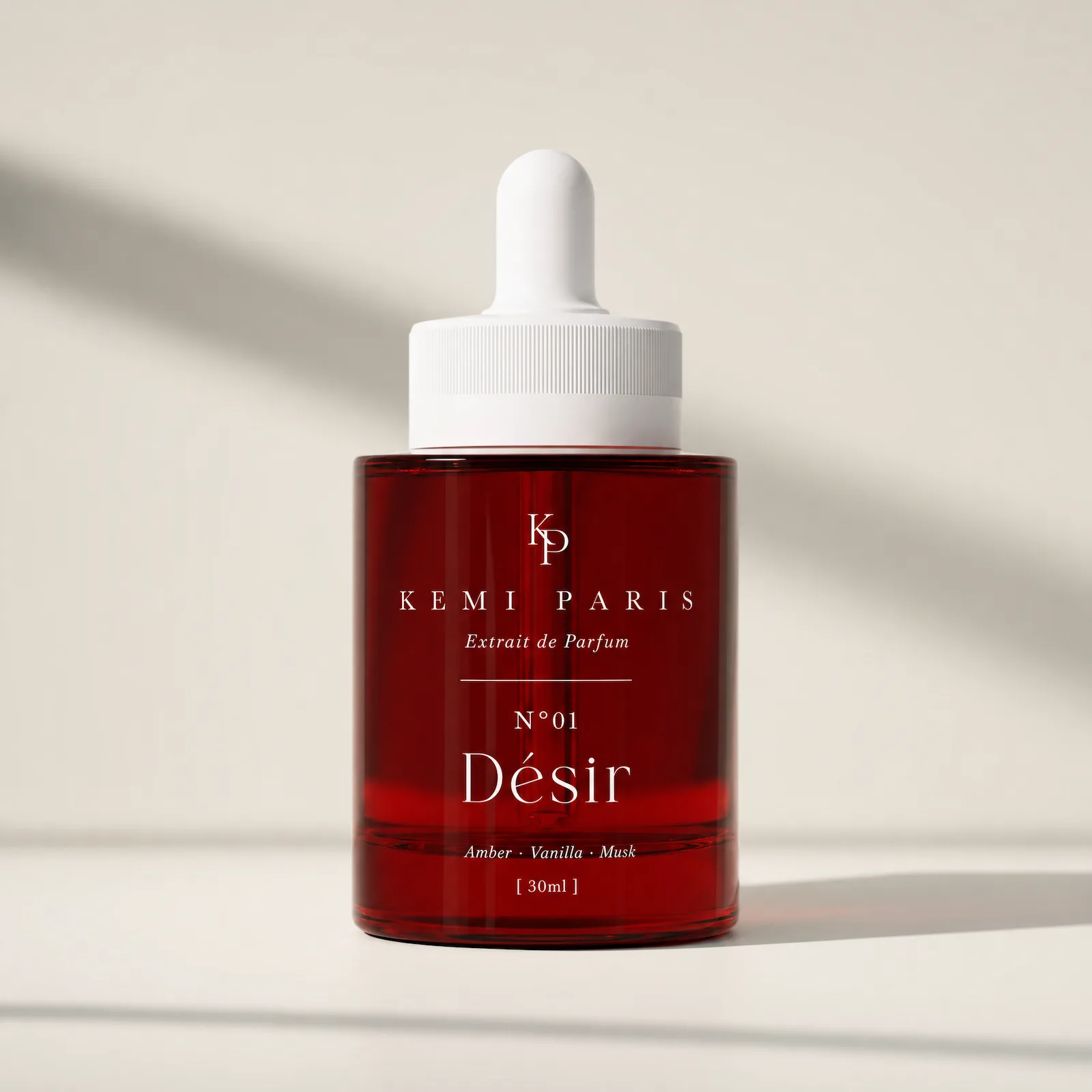 N°01 Désir, the red cylinder extrait bottle